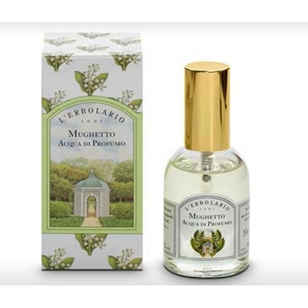 Bottiglia MUGHETTO Acqua di Profumo L'Erbolario su sfondo floreale